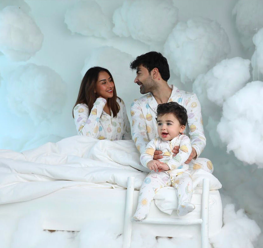 Baby in a hand-illustrated Adam Star sleepsuit